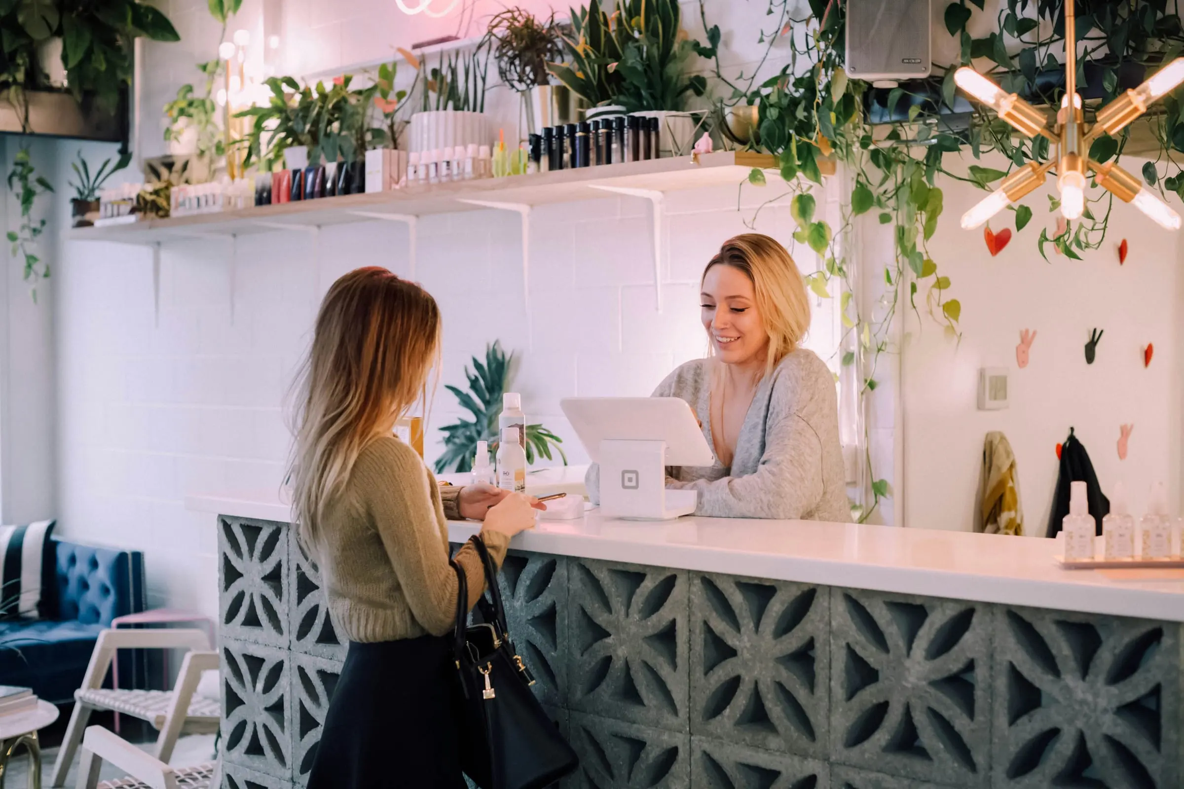 Customer paying at a shop counter